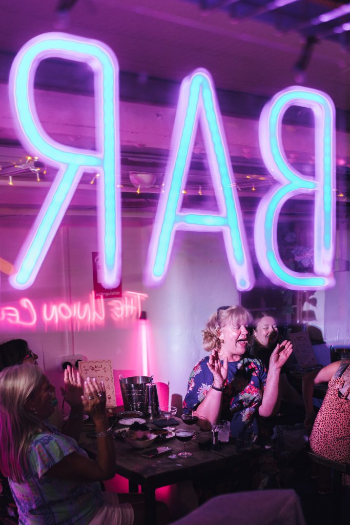 Cocktail Masterclass at the Orator, group of ladies laughing while making cocktails