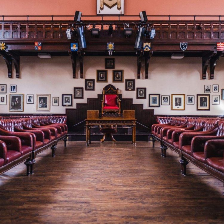 The Cambridge Union Members Club Cambridge (3) The Cambridge Union Society Debate Chamber benches and altar